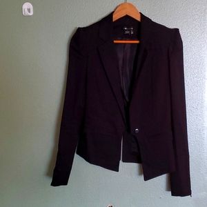 Short black jacket with pointed shoulders